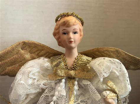 Vintage porcelain angel tree topper - New Listing Vintage Angel Christmas Tree Topper Porcelain Head Illuminated 10” Gold Lace. Opens in a new window or tab. Pre-Owned. $29.99. mando1999 (7,654) 99.9%. 